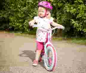 Girl with balance bike