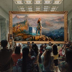 People taking pictures in an art gallery but the image is Laufey from God of War