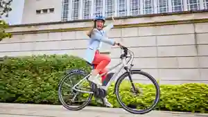 Woman riding a Raleigh Motus electric bike