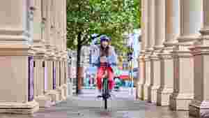 Lady riding a Raleigh Motus ebike in the City