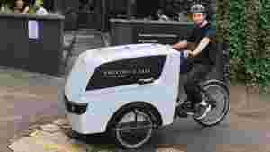 Man riding a Raleigh Pro Cargo Trike for last mile business deliveries