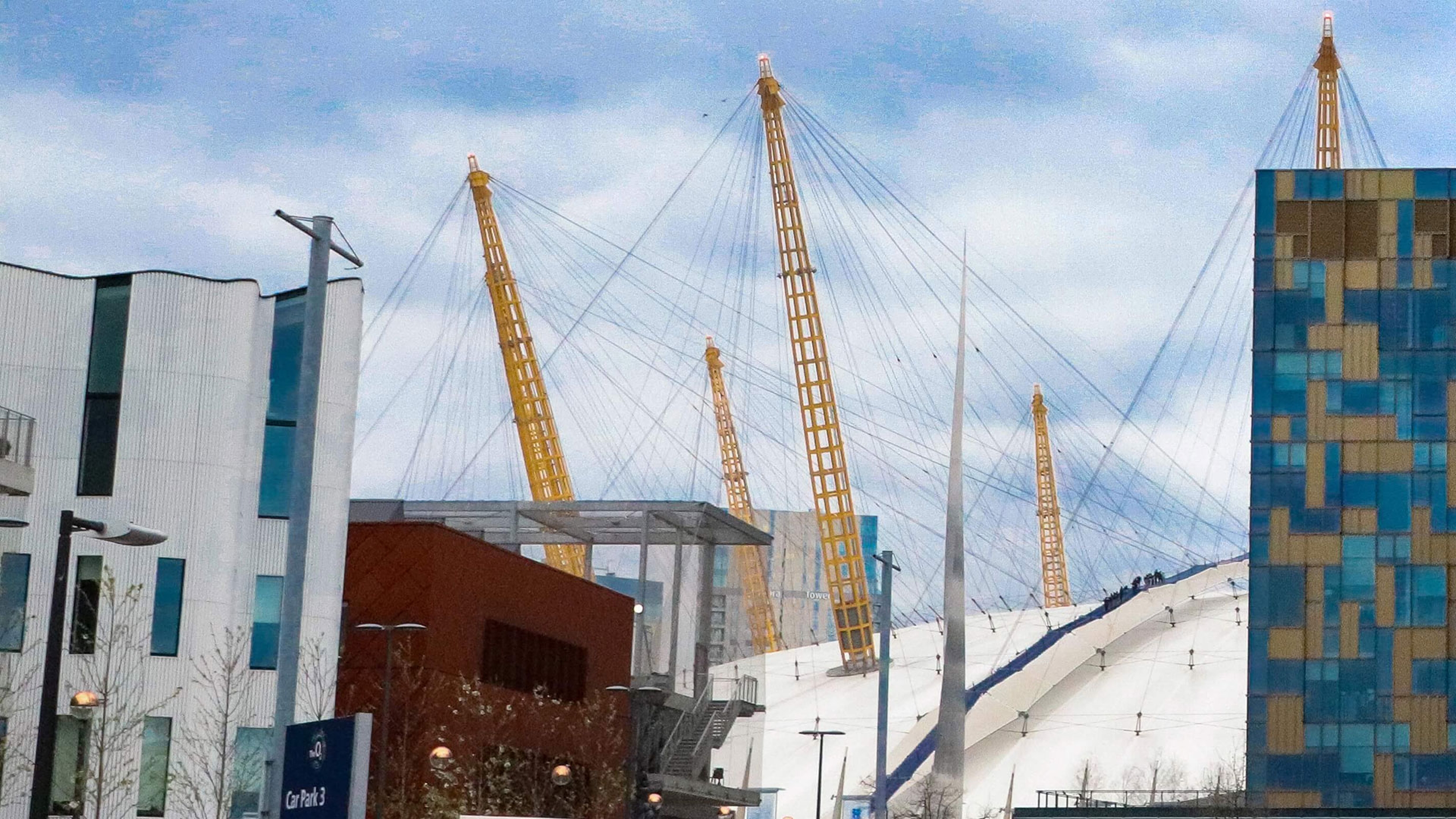 o2 arena and surrounding buildings on a sunny day