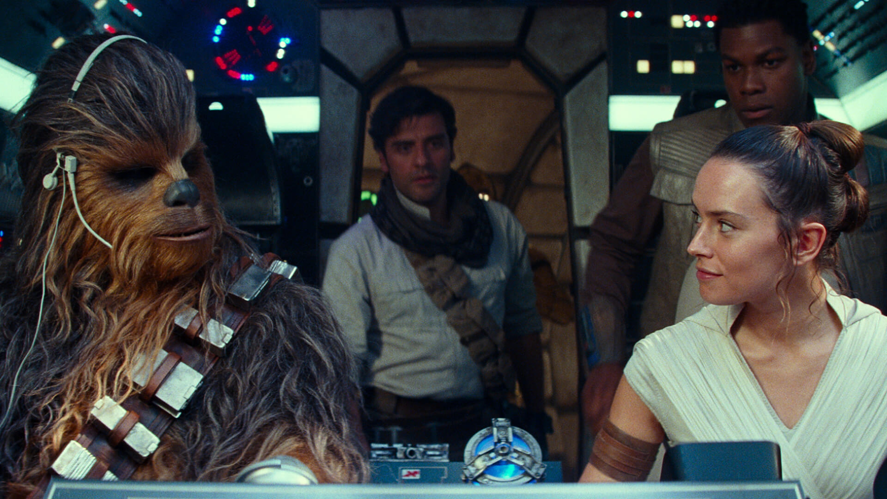 Four Star Wars characters piloting a spaceship