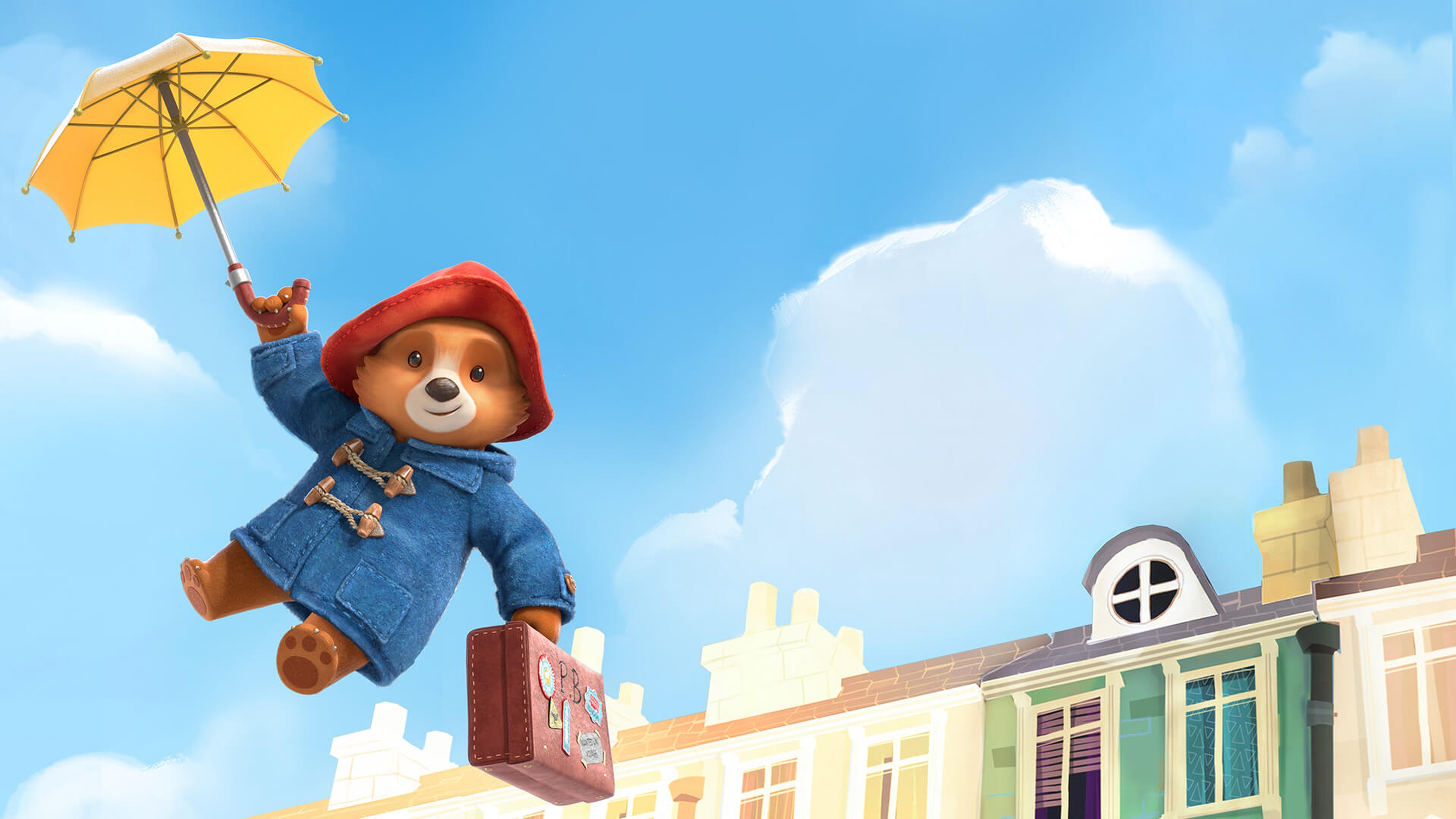 Cartoon Paddington bear floating above buildings