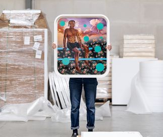 Patrick Quarm framed print being held up by human in warehouse