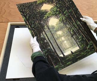 unboxing the print with white gloves
