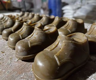 rows of bronze shoes lined up
