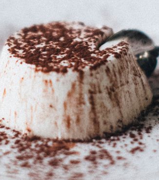 panna cotta sprinkled with cocoa powder