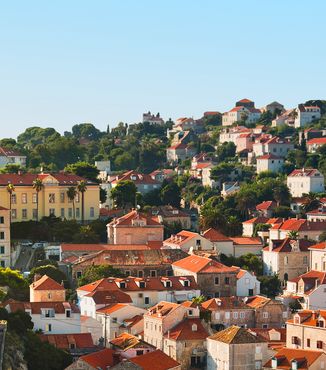 buildings in dubrovnik on the hill with orange roof tops