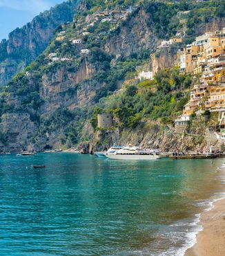 boats sitting in marina along the coast of the amalfi coast in italy
