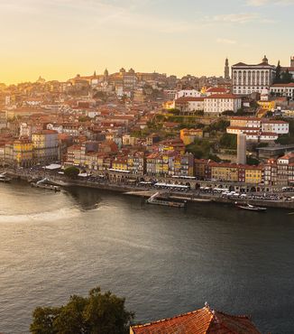 Dom Luís I Bridge in portugal over the duoro river at sunset