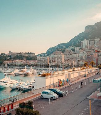 boats docked in a marina along the coast in Monaco