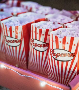 red and white stripped bags filled with popcorn