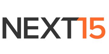 The Next15 Communications PLC logo is seen in a potent contrast of black and orange.