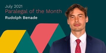 Rudolph Benade, Paralegal of the Month, smiles at the camera. Behind him, the edges of the Flex Legal branding lightly caress his shoulders.