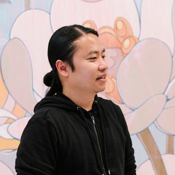 artist in his studio wearing black hoodie