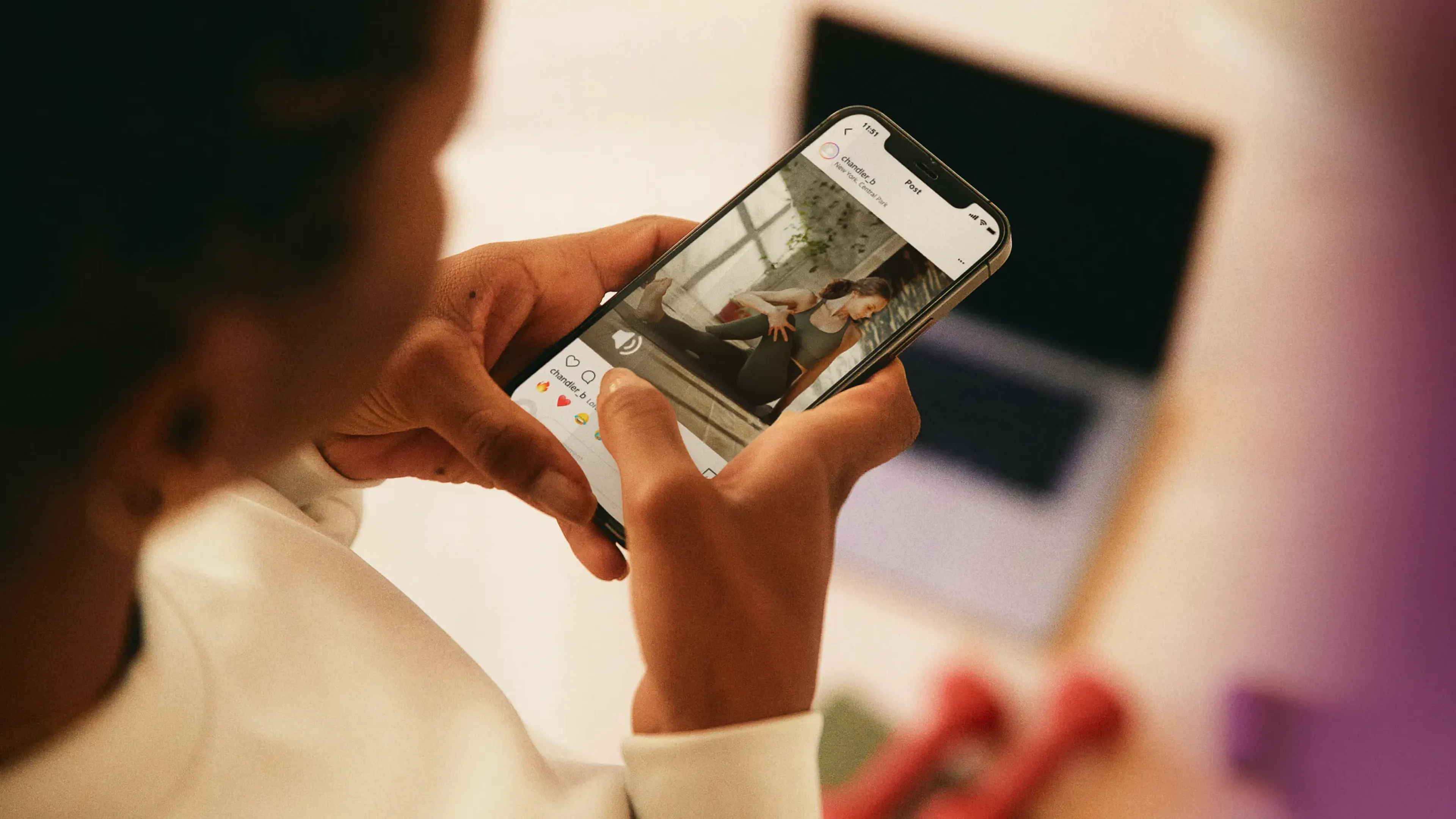Woman watching a social video on her phone at home, music strategy and licensing for social media