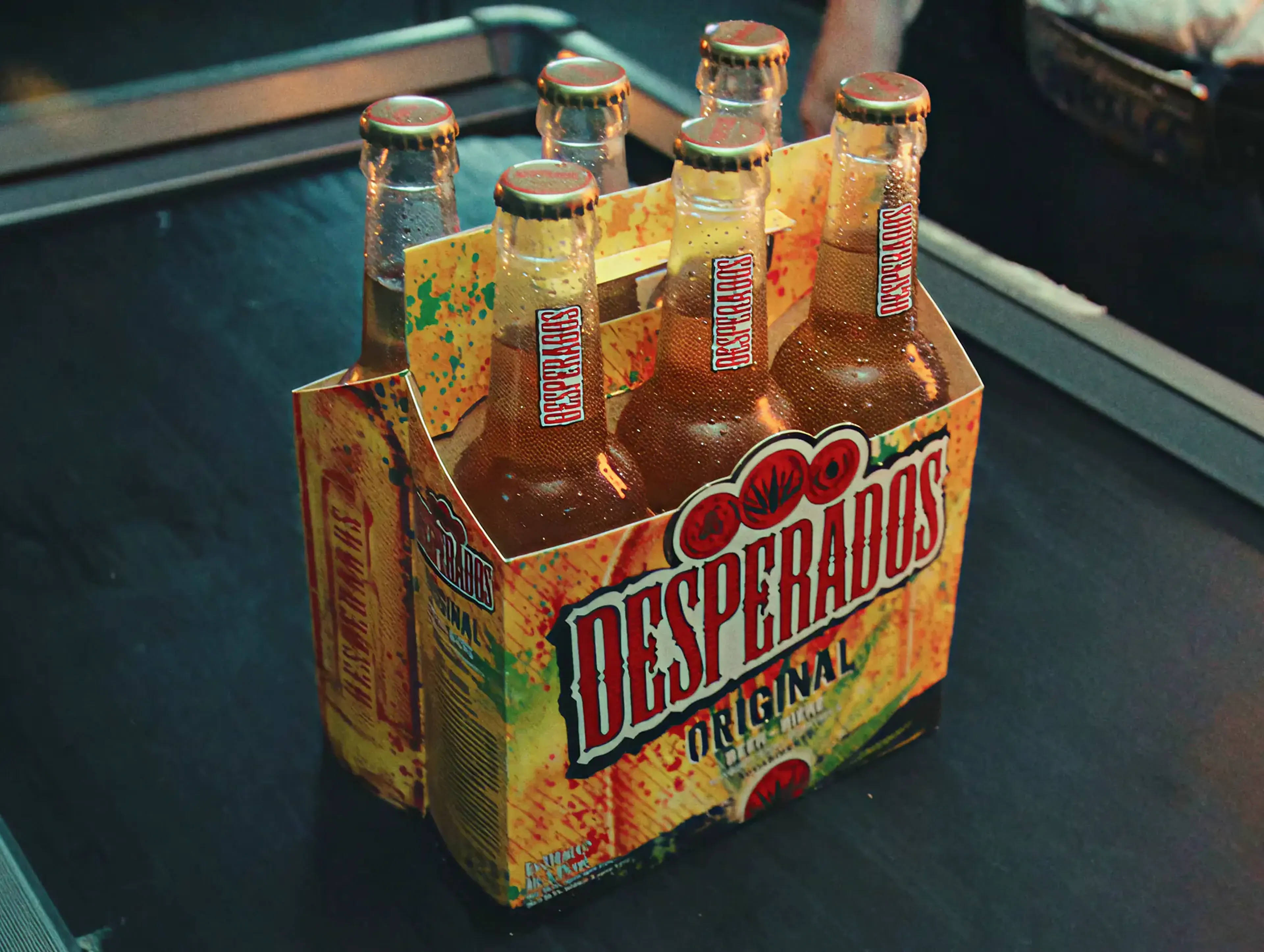 Six-pack of Desperados beer bottles, from the MassiveMusic Desperados campaign