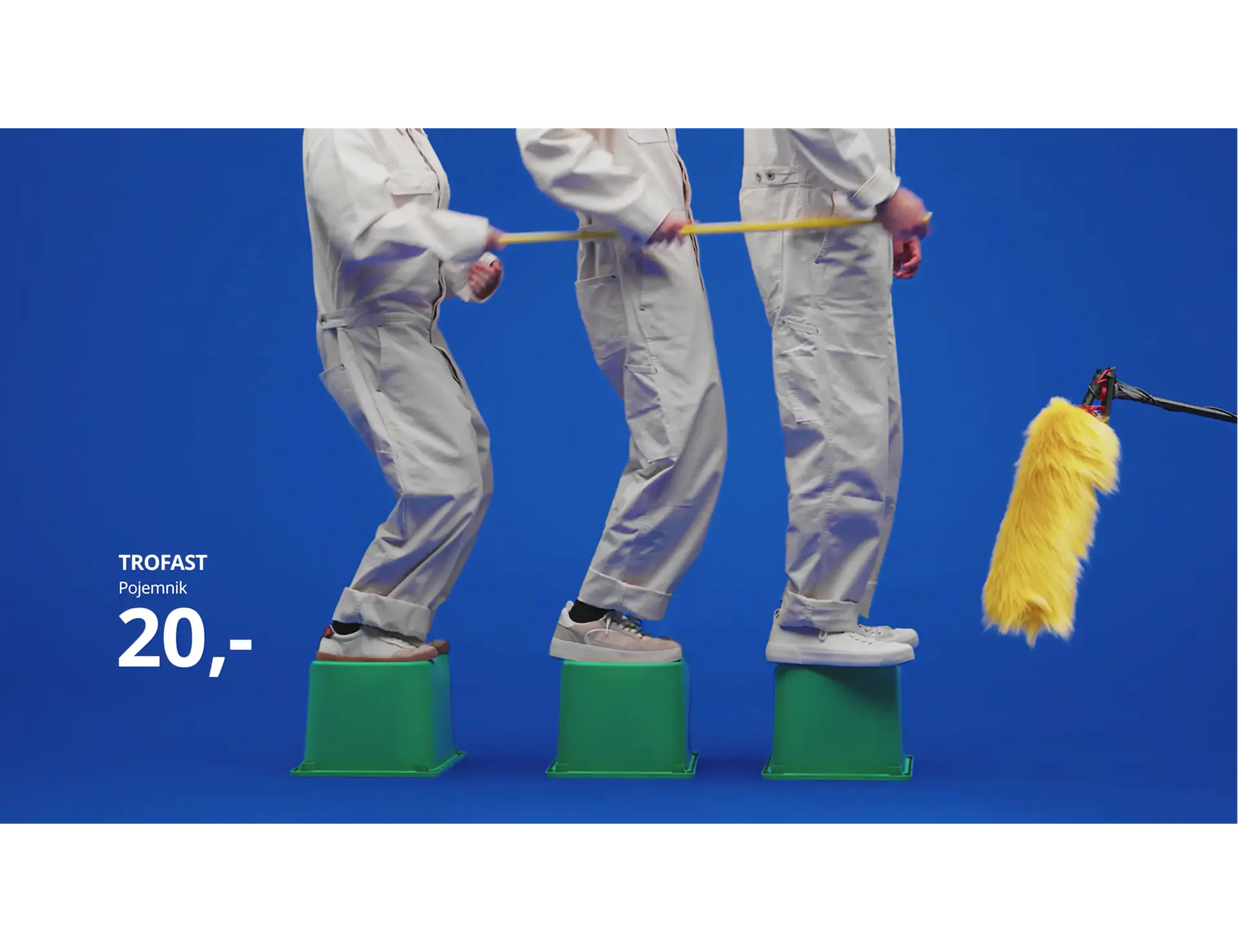 People in overalls on TROFAST boxes beside a boom microphone, recording for the Sound of IKEA campaign