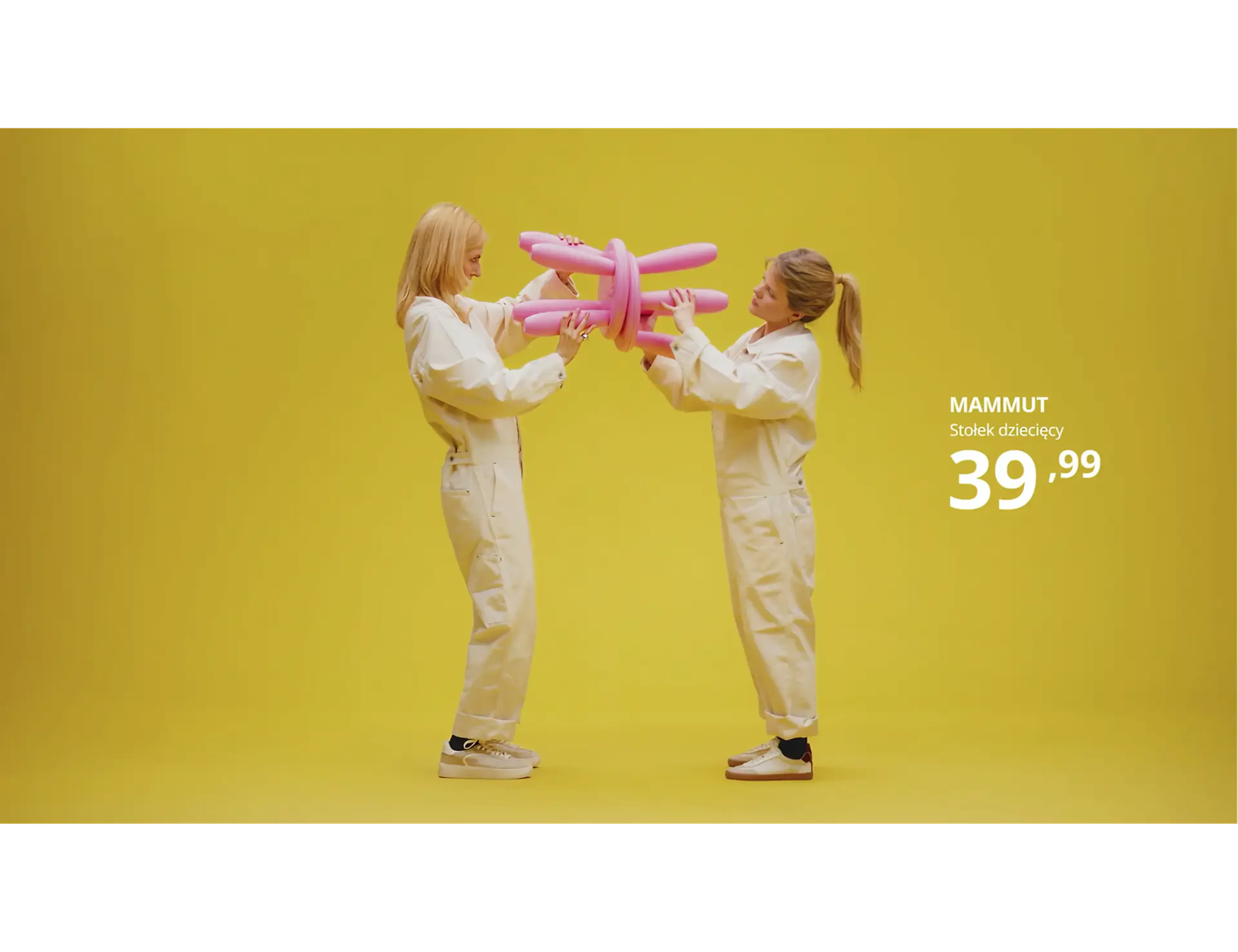 Two people holding a pink MAMMUT children's stool on yellow, from the Sound of IKEA campaign