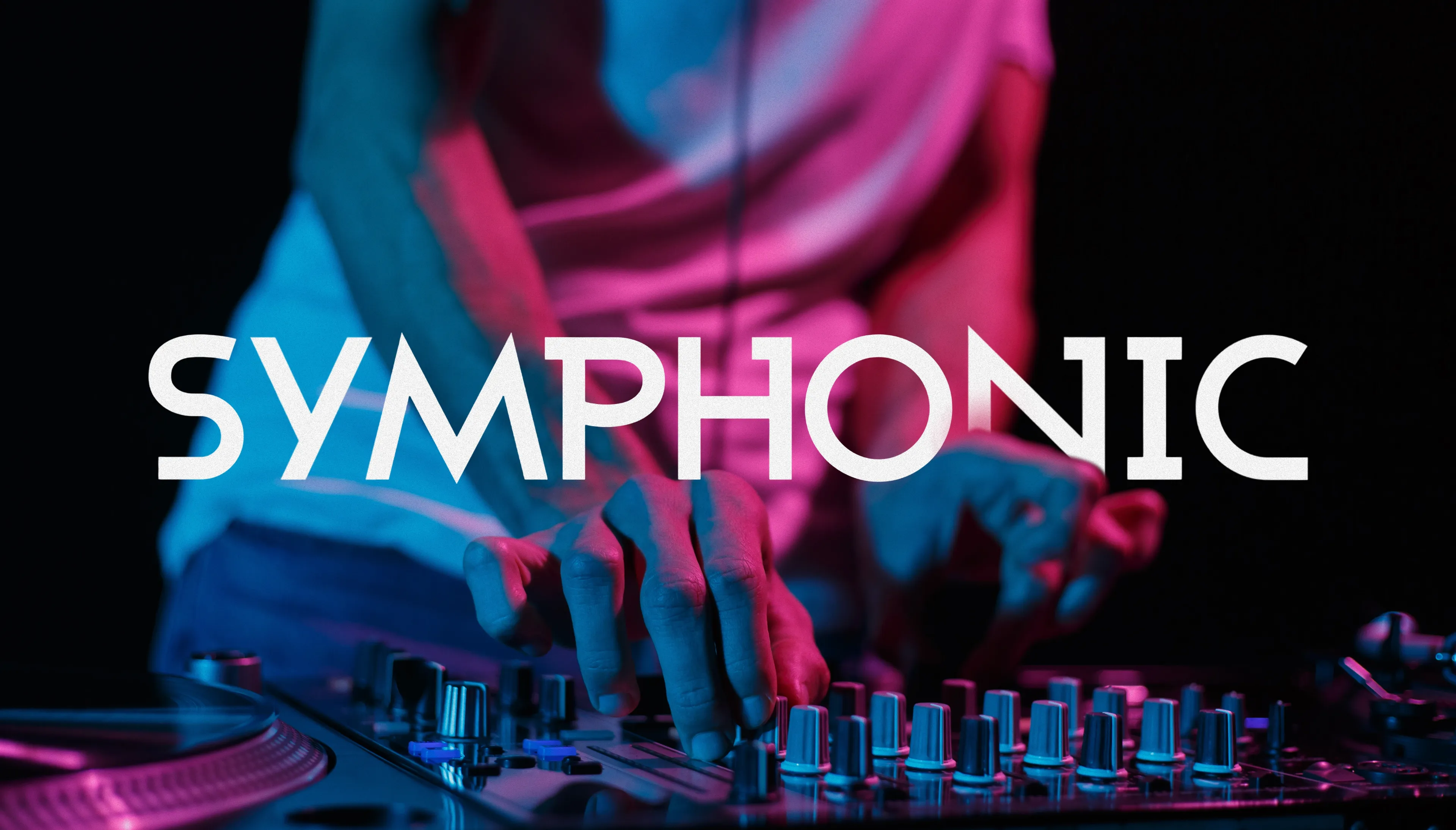 DJ's hands mixing on an illuminated controller under blue and pink club lighting