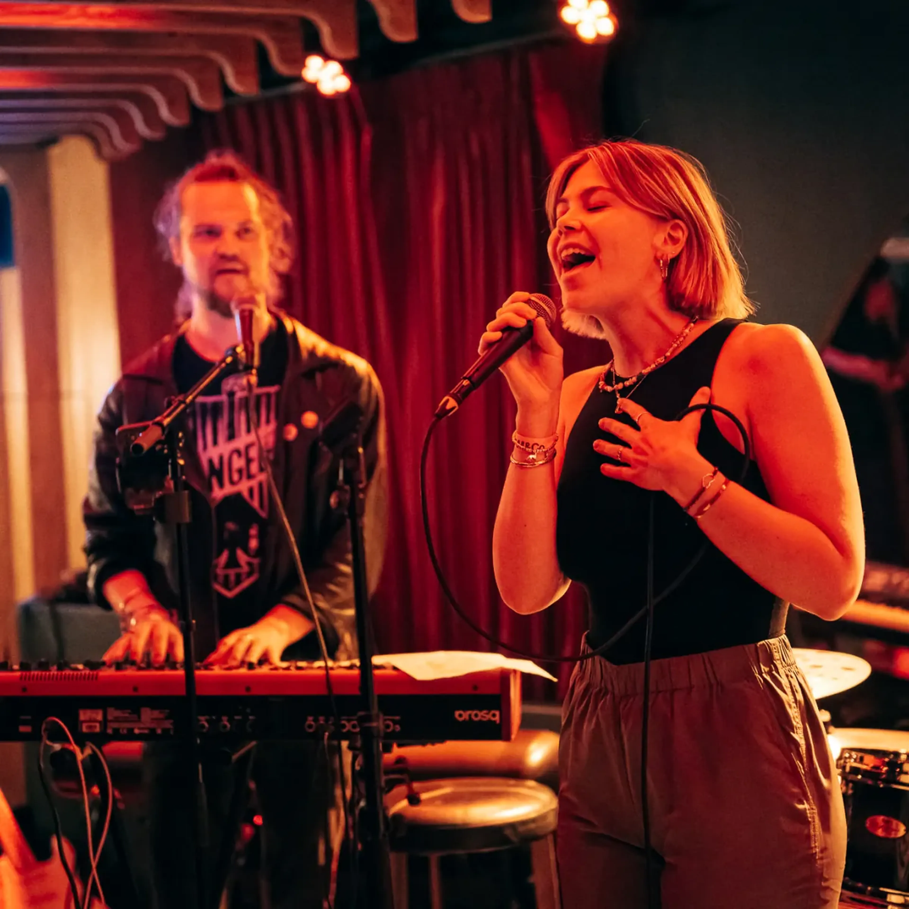 Singer and keyboardist performing at a MassiveMusic live music session