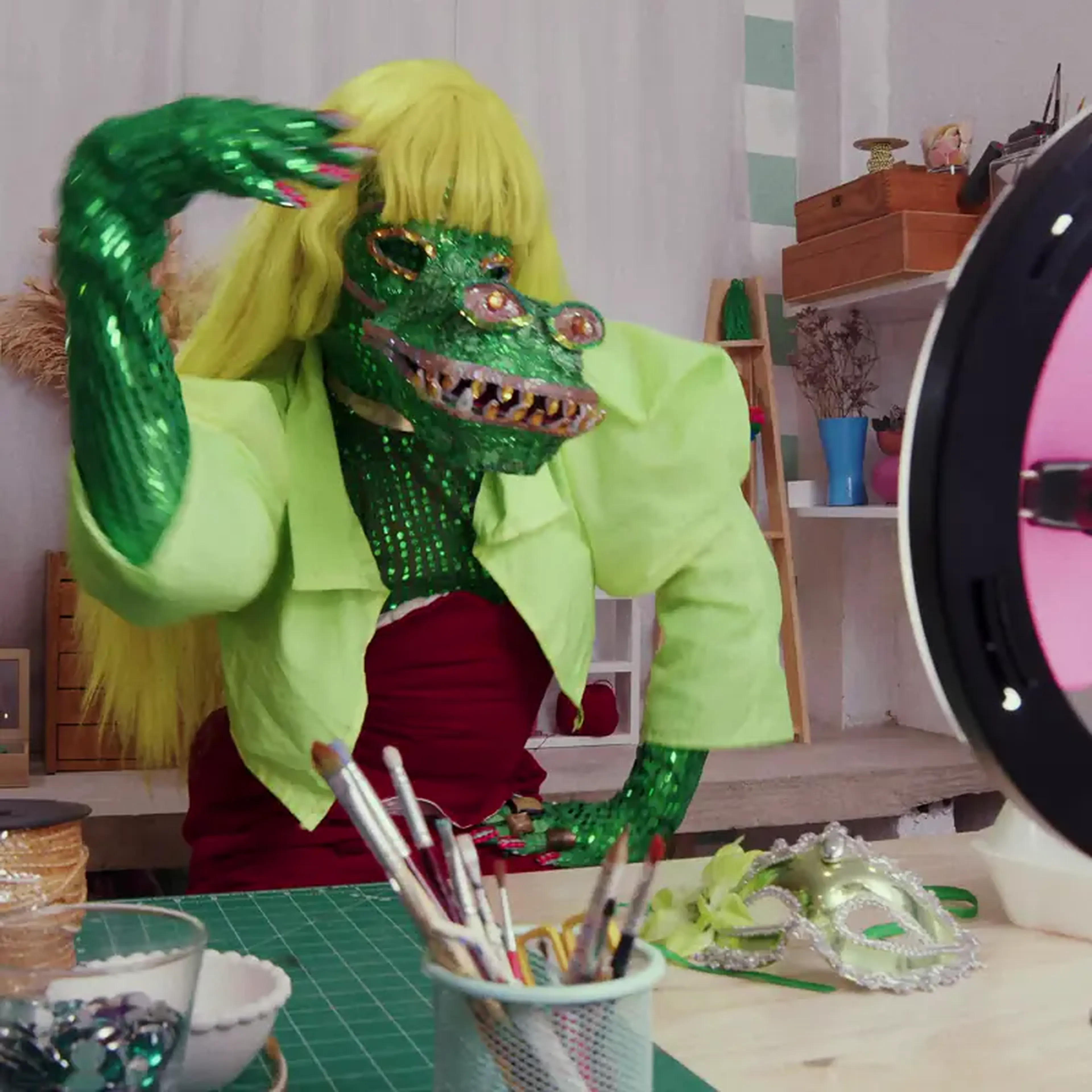 TikTok creator in a handmade costume in a craft studio