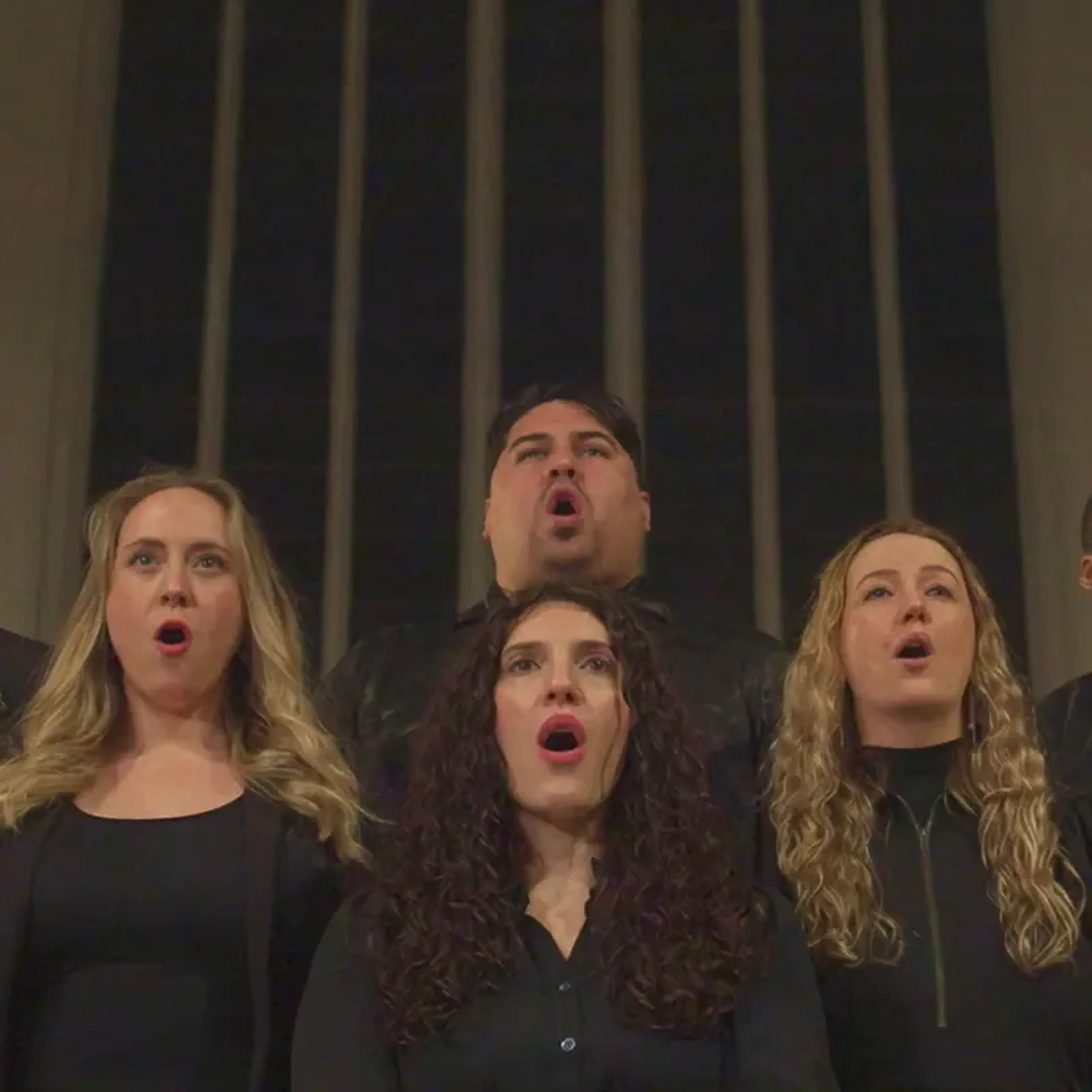 Choir singers performing and looking upward, from the Sound of Leffe campaign