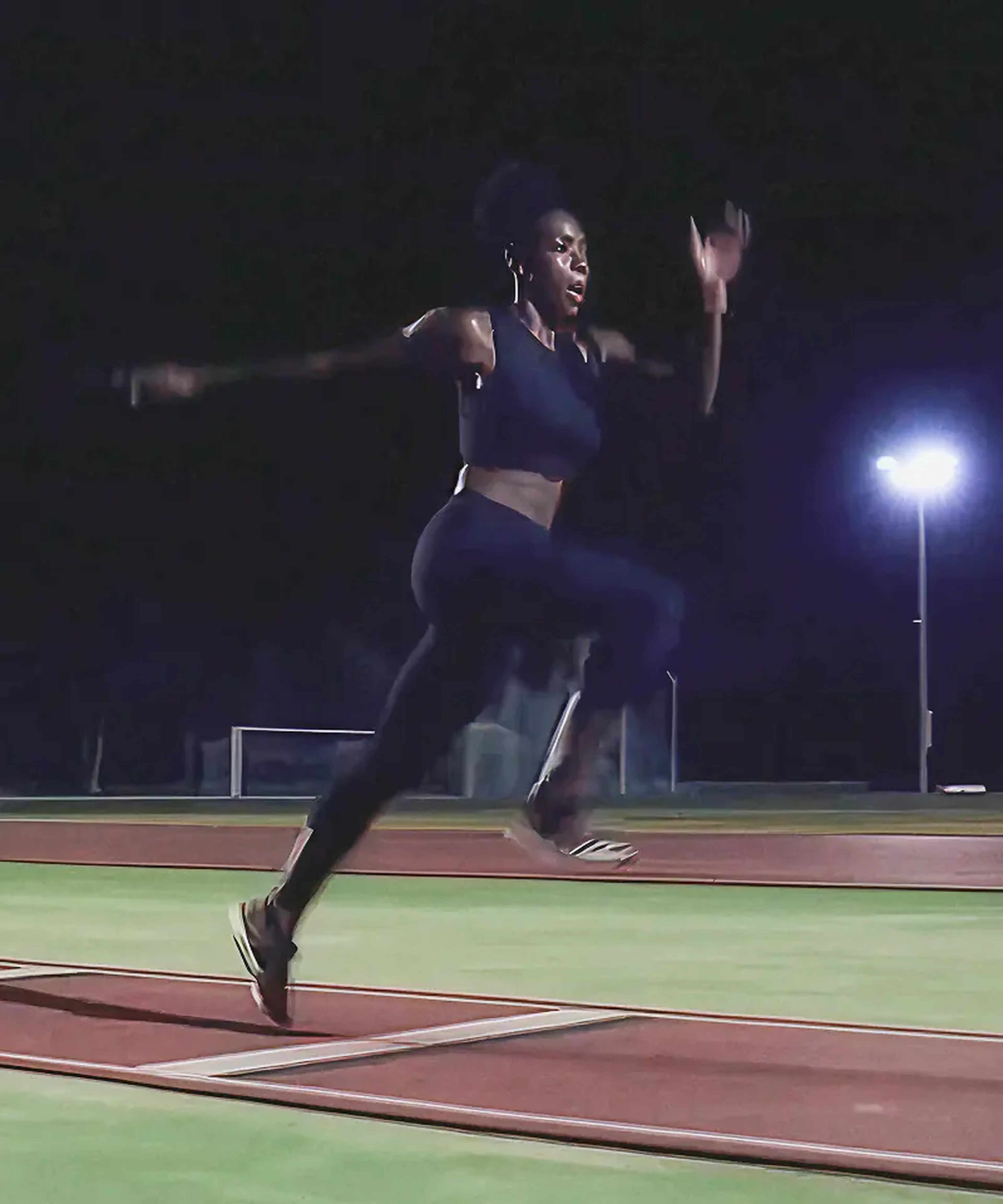 Female sprinter running on a track at night, from the Sound of Samsung campaign