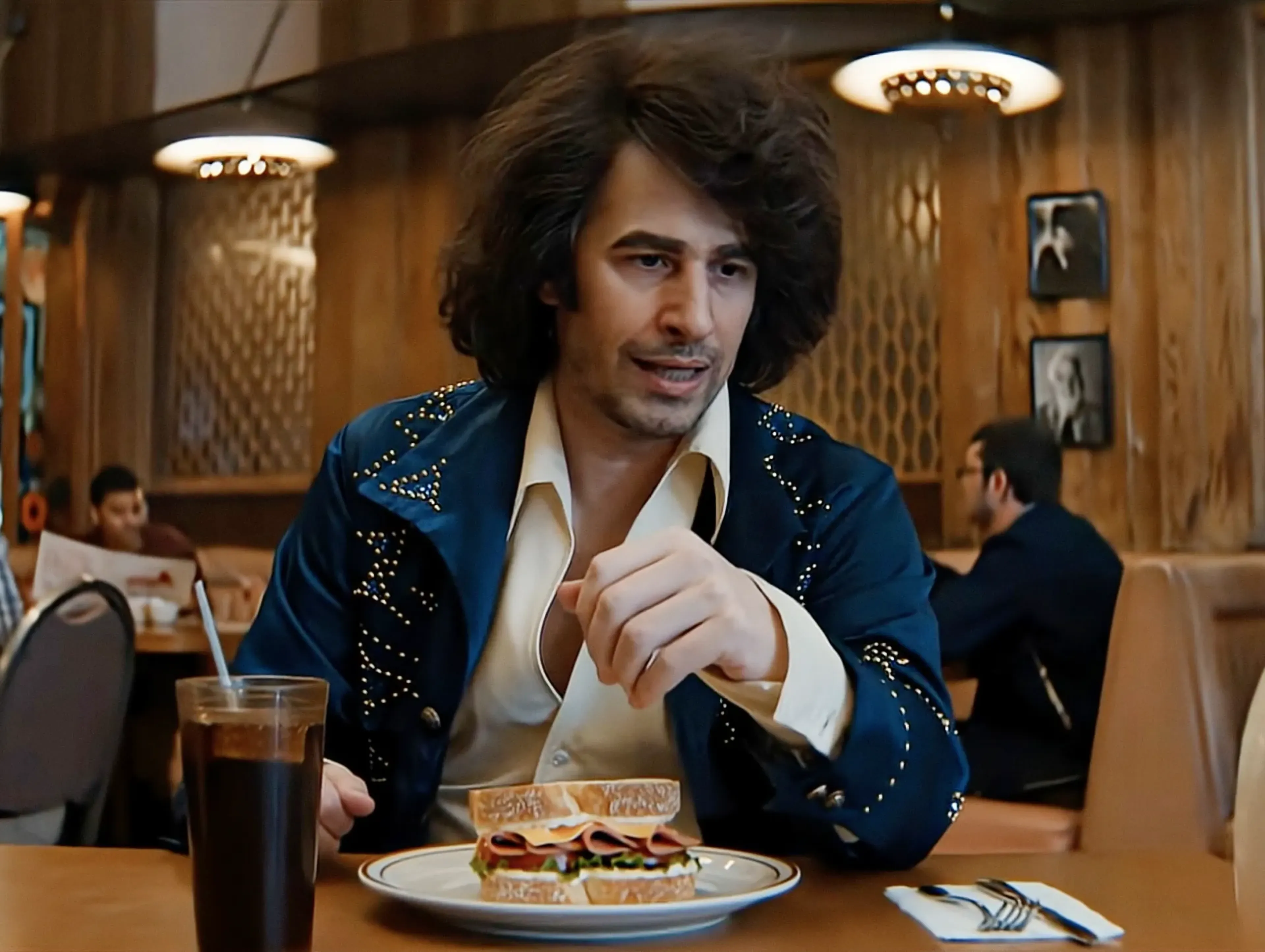 Meal Diamond in a rhinestoned jacket at a diner table with a sandwich, in the MassiveMusic Hellmann's Super Bowl campaign