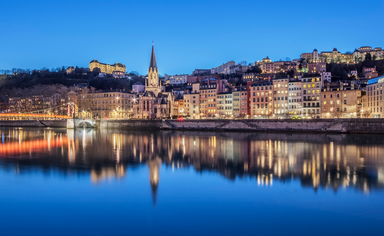 Panoramic view of Lyon with Saone river by night, France.