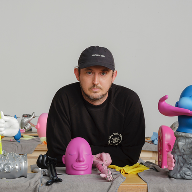 Mark Whalen surrounded by his sculptures