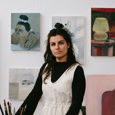 Aubrey Levinthal staring towards the camera in her studio