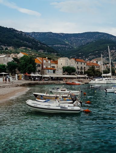 Boats bobbing at a harbour in Bol, Croatia