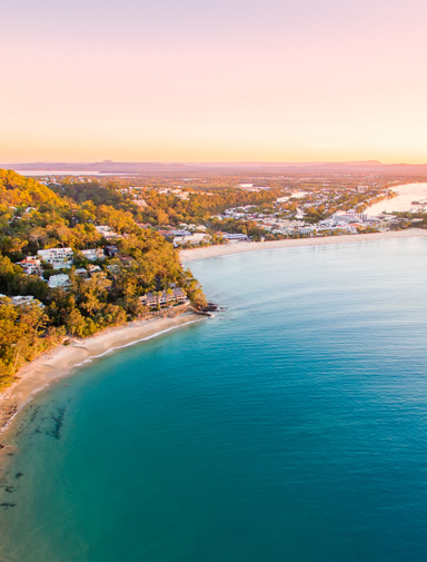 Noosa Heads National Park from an aerial perspective at sunset.