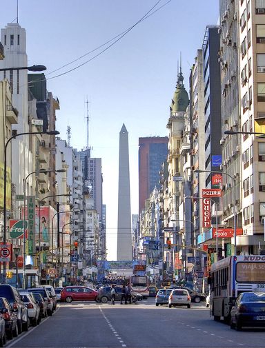 A streetscape of Buenos Aires with the Argentinian obelisk in the background