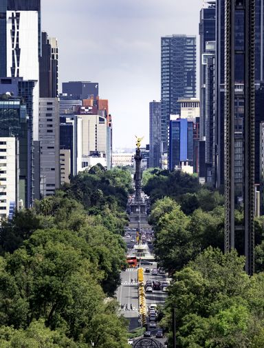 View of Paseo de la Reforma nested between skyscrapers in Mexico City