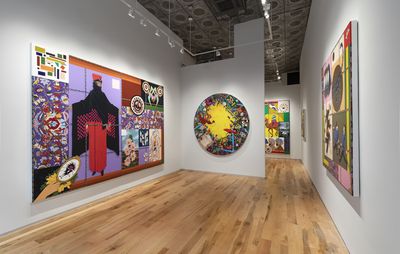 installation view of various large colourful paintings on white walls