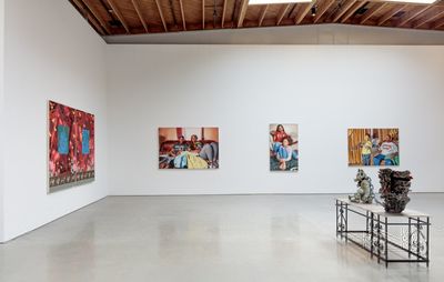 installation view of a group show of paintings and sculptures