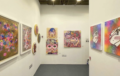 Bell Nakai vibrant pink paintings on wall at show