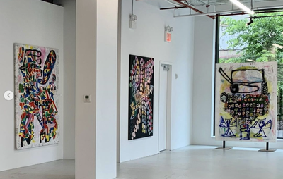 Artworks displayed in a spacious white gallery