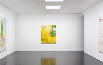 installation view of large gallery space with yellow and green painting hung centrally