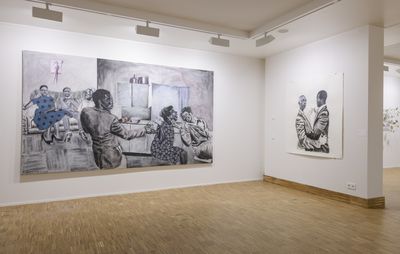 installation view of white gallery walls with two large paintings, one of which is entirely monochrome and the other is predominantly monochrome albeit the blue dress of a woman on the far left of the image