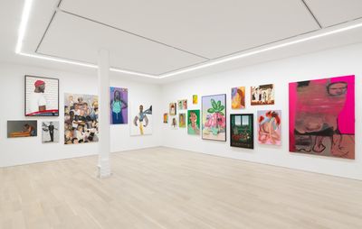 installation view of twenty paintings, all of varying sizes and colours, hung on two white walls