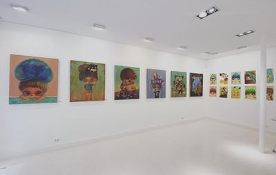 installation view of a white room with square paintings by Ryol hung up
