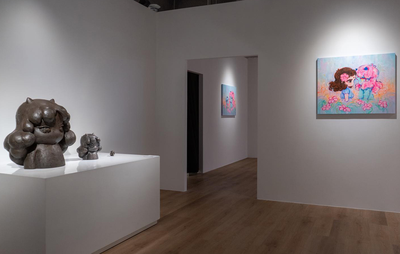 Okokume's artwork displayed in a gallery space