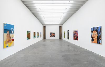 Artworks hanging in a large white gallery space