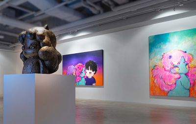 Okokume's artwork displayed in a gallery space
