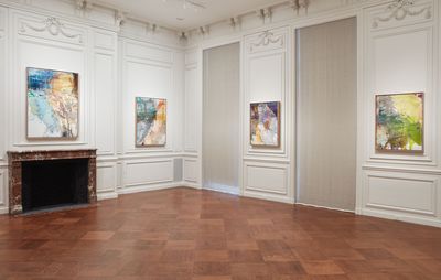installation view of four square colourful paintings hung on white walls