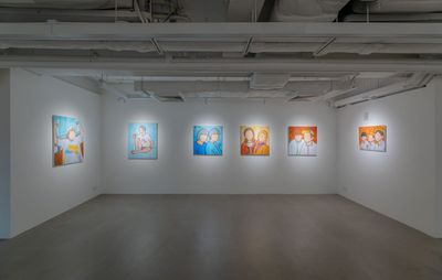 Six paintings hung in a white gallery space